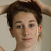 Many Freckles Girl Pulling Hair Back
